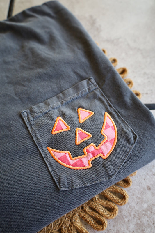 Pink Checkered Jack-O-Lantern Appliqué Comfort Colors Pocket Tee, Halloween Tee